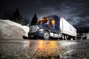 tractor trailer on wintry road