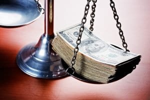 Scales of Justice Weighing Dollars to Determine the Value of a Personal Injury Case