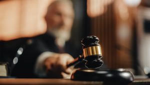 Judge slamming his gavel at a West Virginia personal injury trial