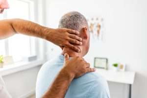 West Virginia orthopedist examines truck accident victim's neck