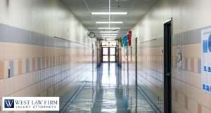 Empty school hallway with polished floors and tiled walls, representing premises liability concerns and injury claim support for accidents on school property
